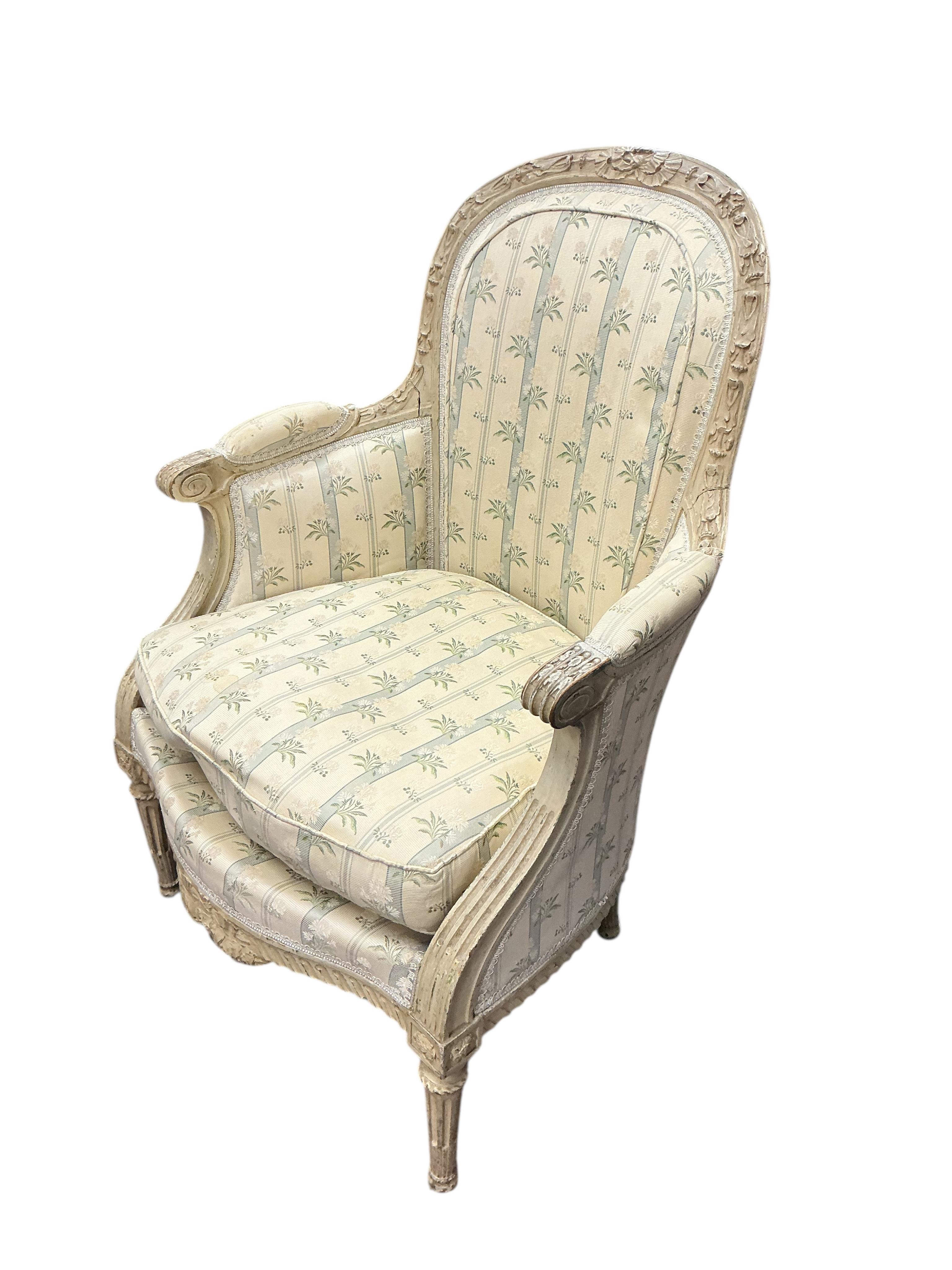 A Louis XVI style upholstered painted armchair, width 68cm, 54cm, height 98cm
